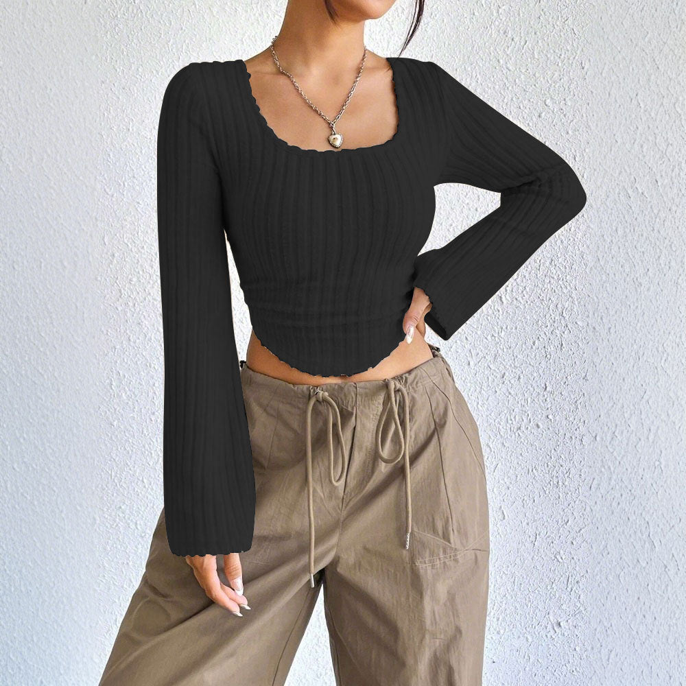 Kvinders langærmet crop top med dekorativ ribdesignet og afrundet bund Stilla