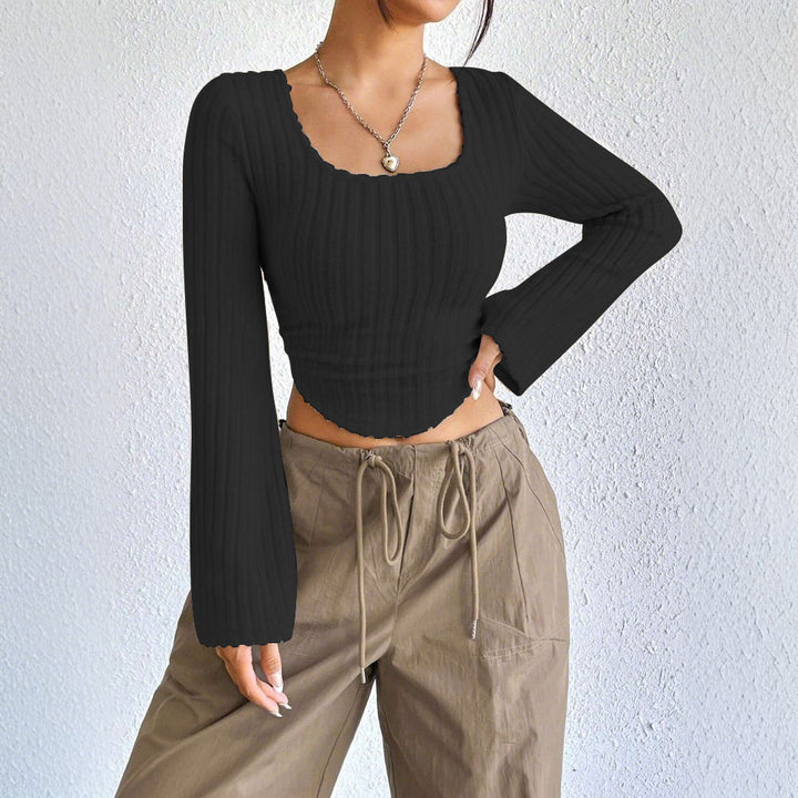 Kvinders langærmet crop top med dekorativ ribdesignet og afrundet bund Stilla