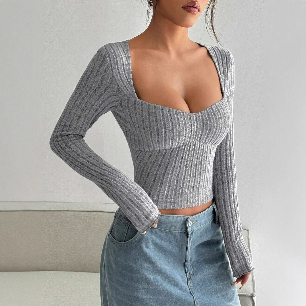 Kvindernes langærmede crop top med dyb V-hals og ribbet tekstur Stilla