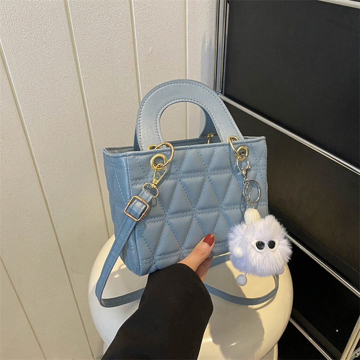 Femme quilted håndtaske med aftagelig charme Stilla