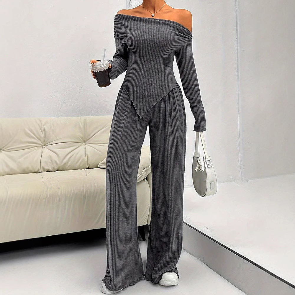 Dame tætsiddende jumpsuit med asymmetrisk udskæring og lange ærmer Skovae