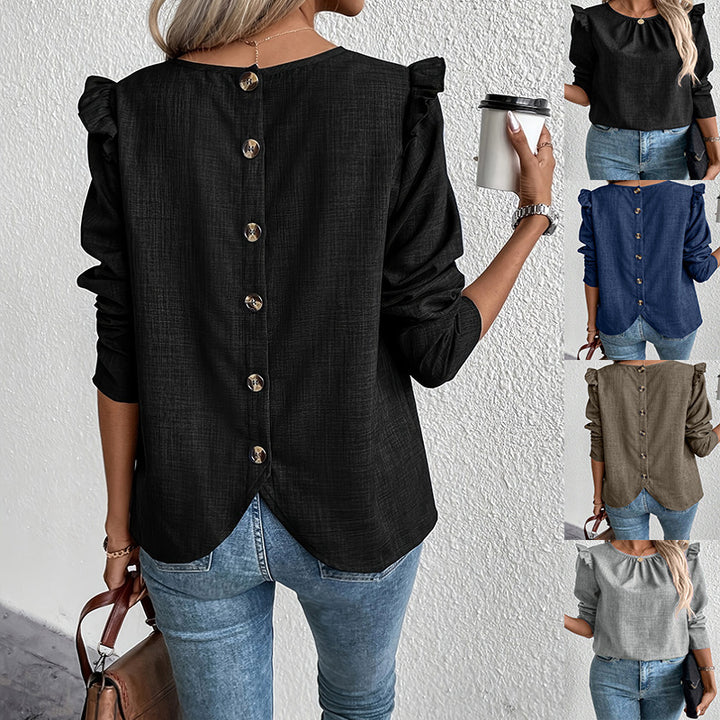 Damebluse med ruffledetaljer og knaplukning Stilla