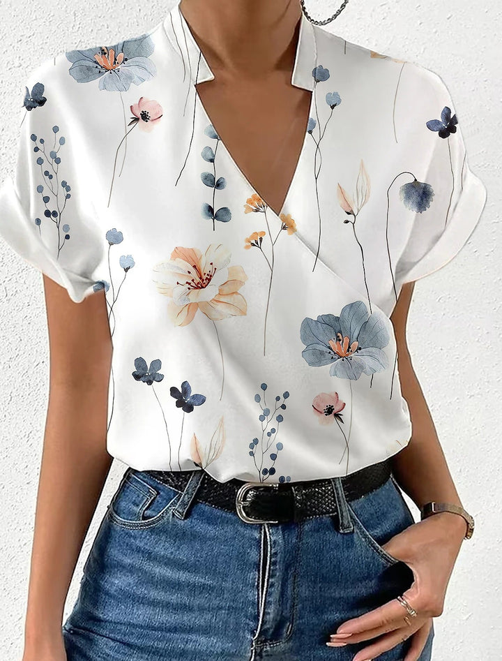 Dame elegant bluse med floralt design og subtil krave Stilla
