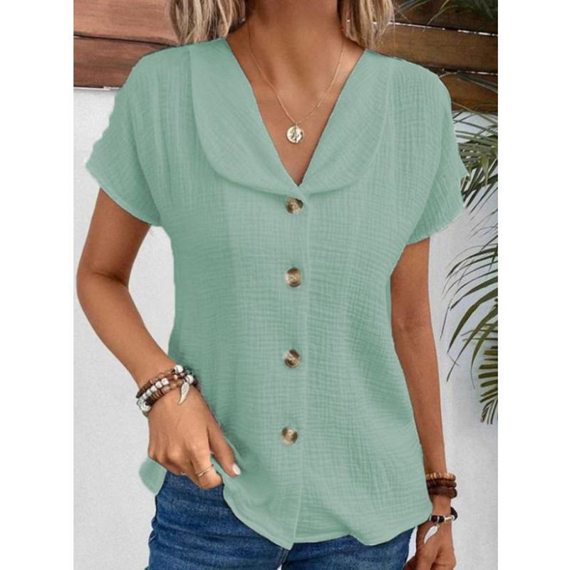 Damebluse med elegant klapkrave og dekorative knapper Stilla