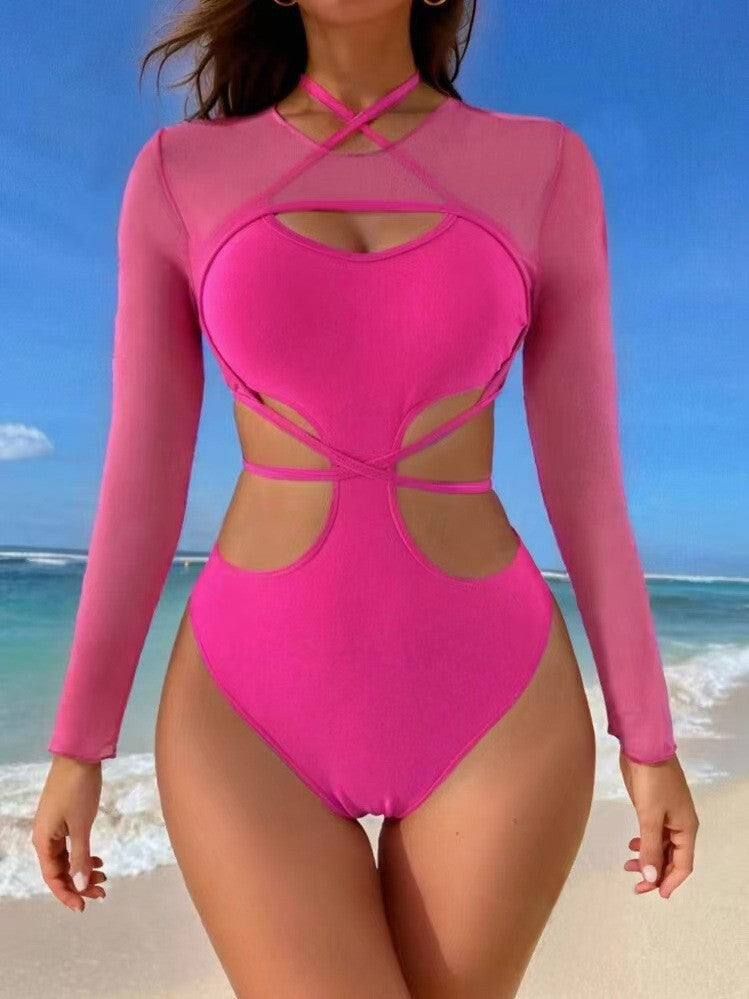 Dame et-stykke badedragt med raffineret cut-out design og lange ærmer Stilla