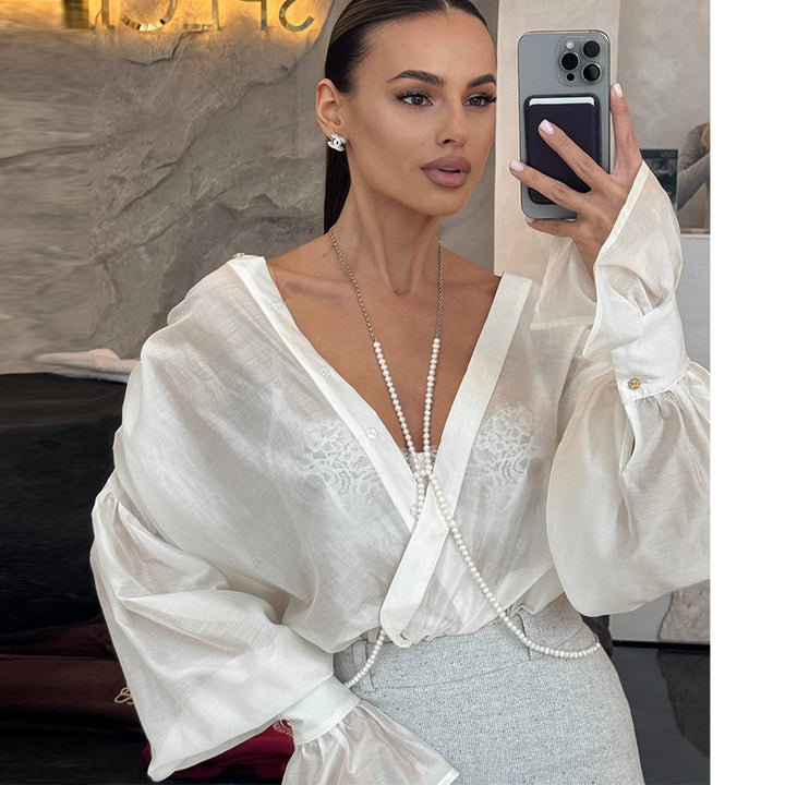 Damebluse med voluminøse ærmer og elegant snit Stilla