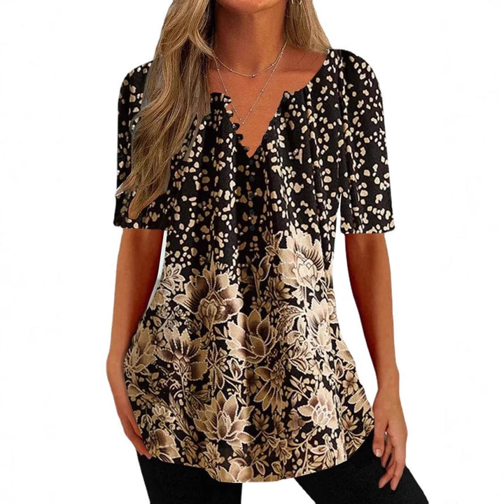 Damebluse med blomstret og elegant design Stilla