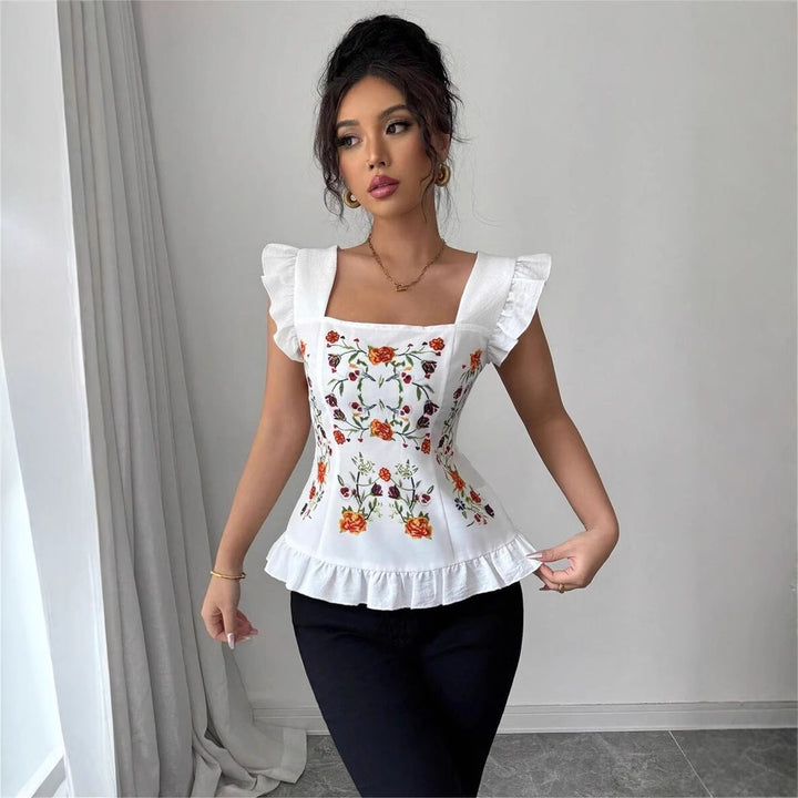 Damebluse med blomster broderier og flæse detaljer Stilla