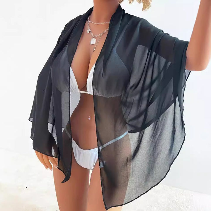 Damer Strandtowel med elegant knude-design og luftig gennemsigtighed Stilla