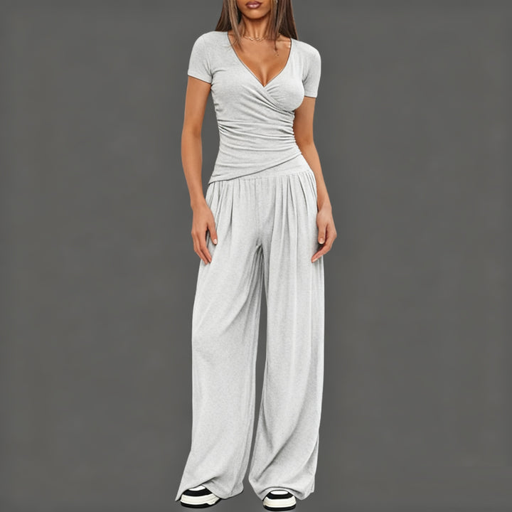 Dame afslappet jumpsuit med omslagsdesign og bredt ben Skovae