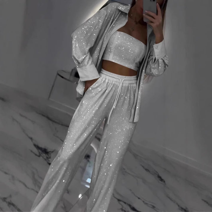 Dame fritids-loungewear sæt med glitrende top og elastiske bukser Stilla
