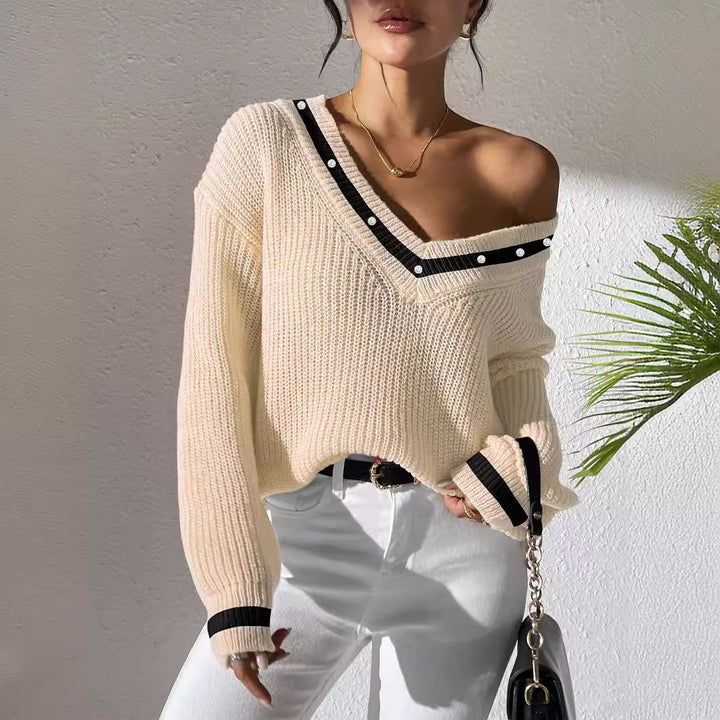 Dame oversized strikpullover med V-udskæring og elegante perledetaljer Stilla