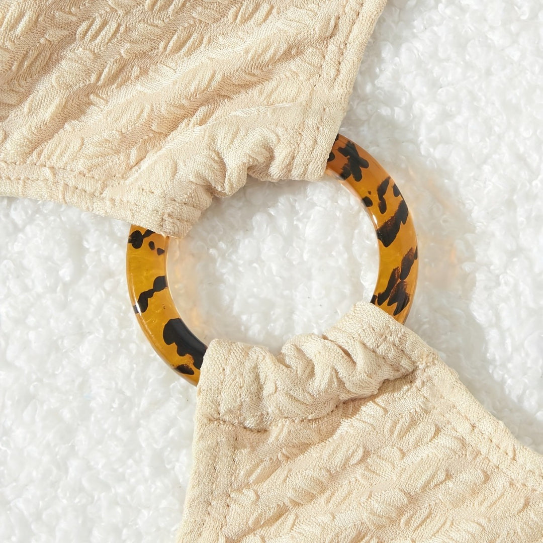 Dame et-stykke badedragt med asymmetrisk design og dekorativ ring Stilla