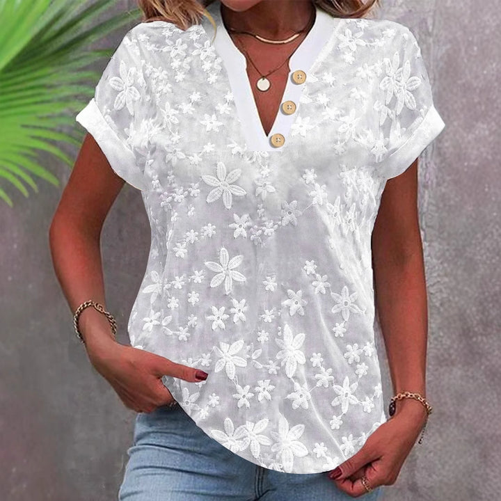 Damer elegant bluse med blomsterdesign og knapdetaljer Stilla