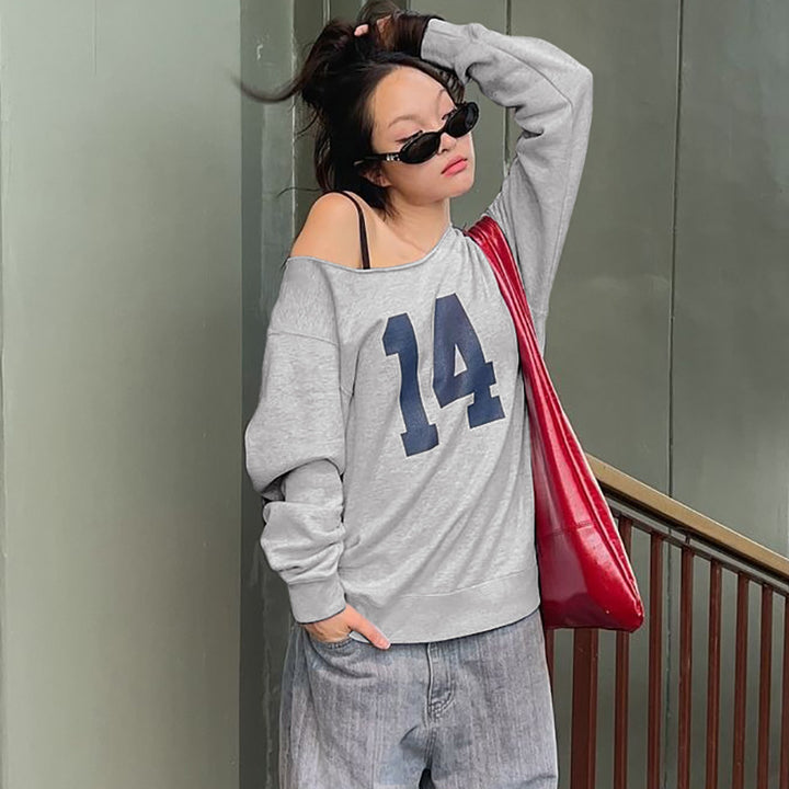 Dame sporty oversized pullover med off-shoulder skæring og iøjnefaldende print Stilla