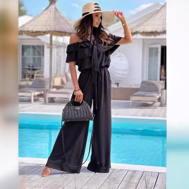 Dame jumpsuit med skulderfri design og bredt ben Stilla