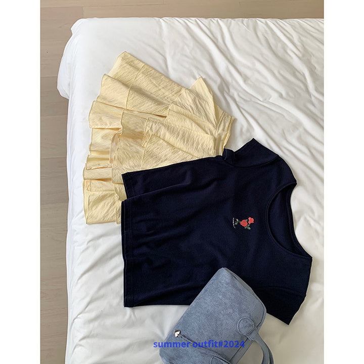 Damer casual top med blomstret design og svajende volangskørt Stilla