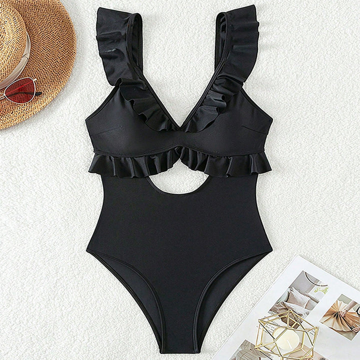 Dame one-piece badedragt med legende flæse design og dyb V-hals Stilla
