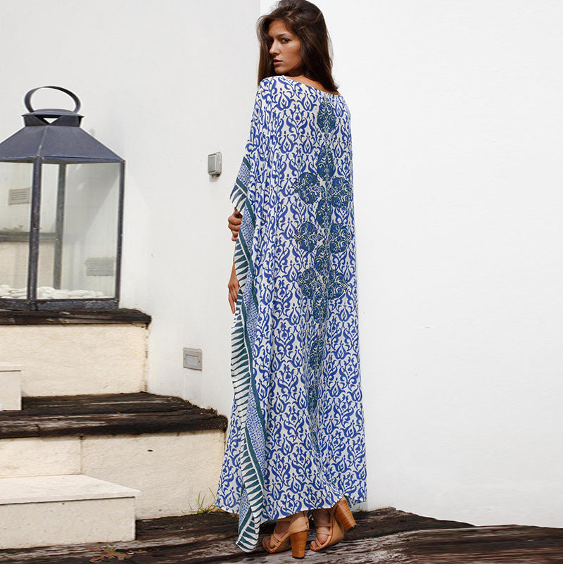 Dame Maxi-strandkjole med stilfuldt floralt design og luftig silhuet Stilla