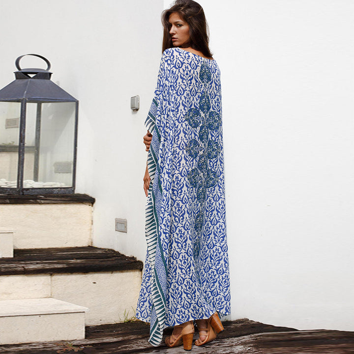 Dame Maxi-strandkjole med stilfuldt floralt design og luftig silhuet Stilla