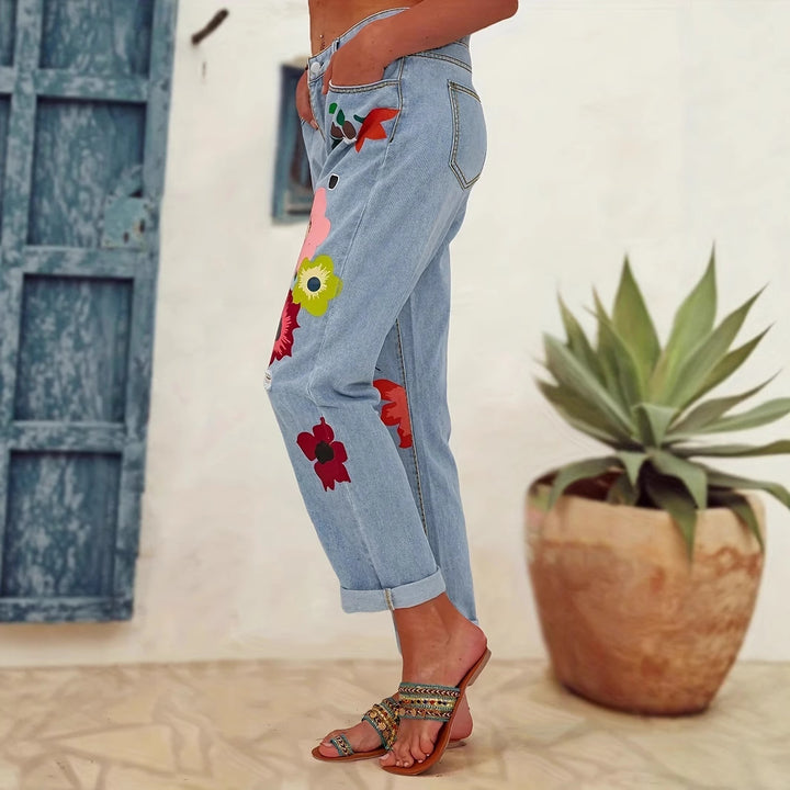 Damejeans med blomstret design og fashionable revnedetaljer Stilla