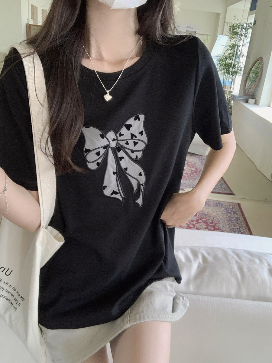 Femme Legende Sløjfe Grafik T-Shirt Stilla