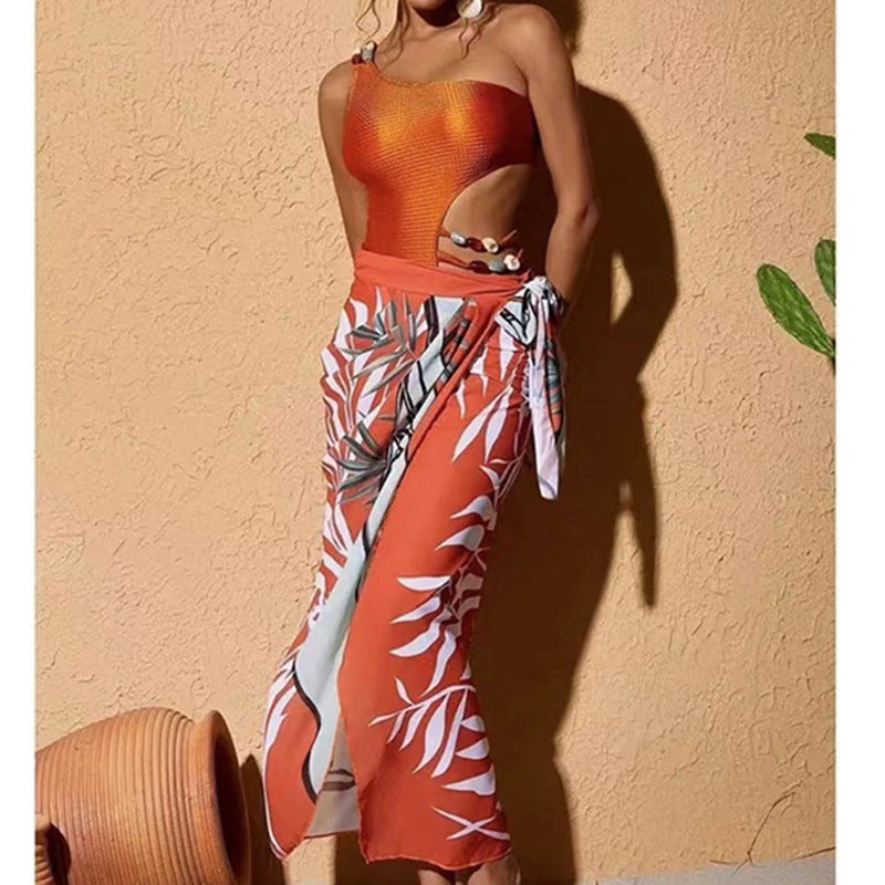 Dame one-piece badedragt med smart cut-out og elegant overkjole Stilla