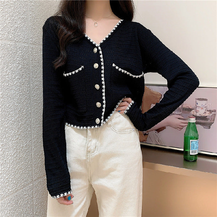 Dame mode cardigan med kontrasterende detaljer og knapstolpe Stilla