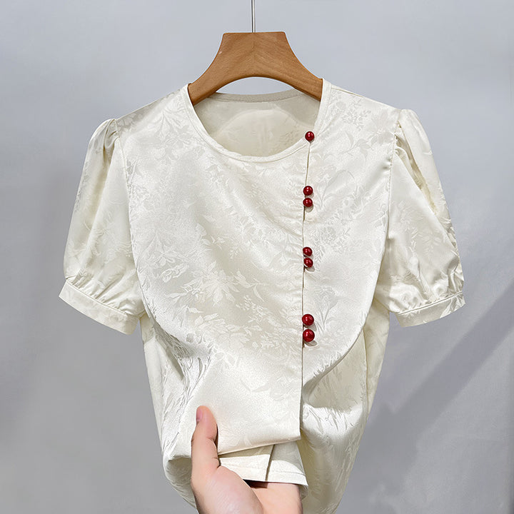 Damebluse med elegant struktur og dekorative knapper Stilla