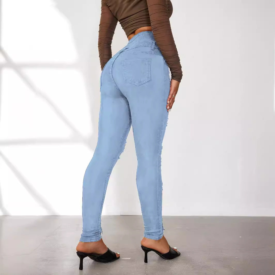 Dame Højtaljede Skinny Jeans i moderne Destroyed-look med knapdetaljer Stilla