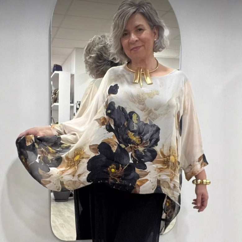 Damebluse med florale accenter og voluminøse ærmer Stilla