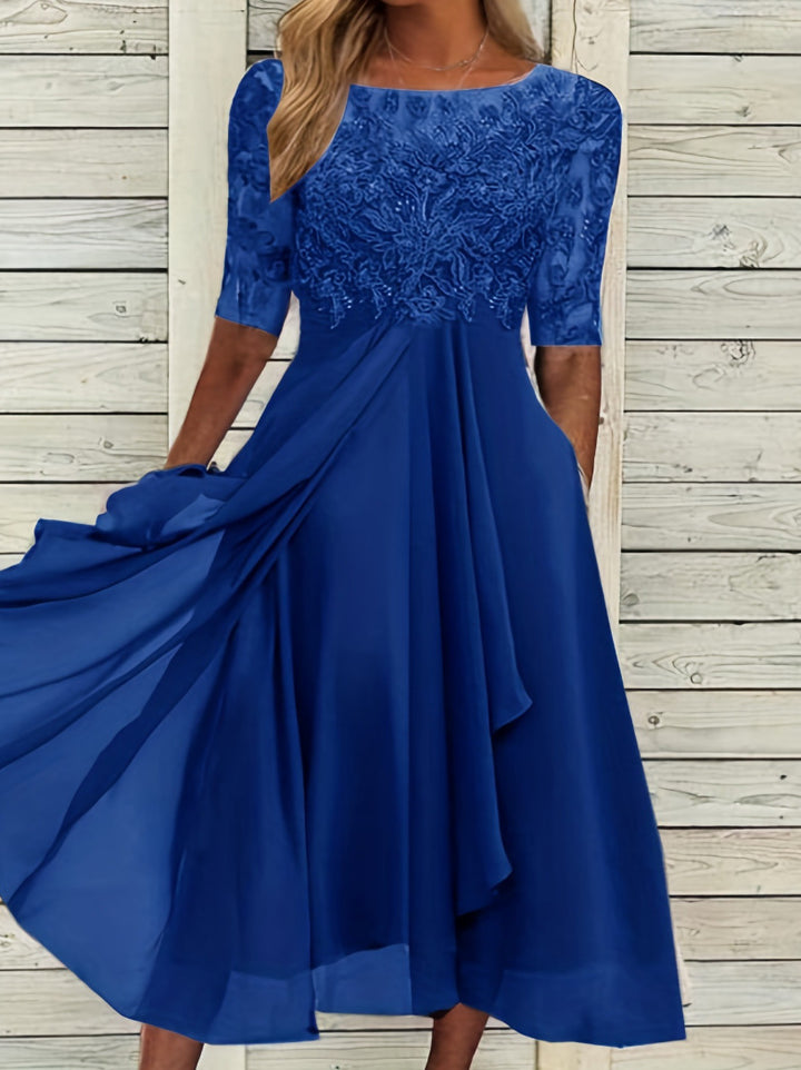 Dame aftenkjole med elegant broderedesign og flydende nederdel Stilla