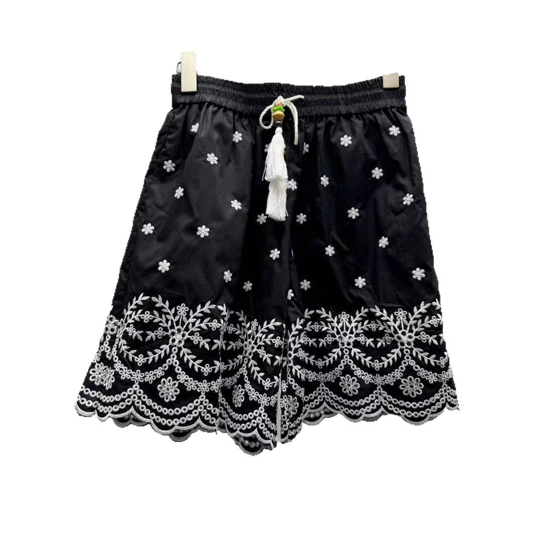 Dame plisseret nederdel med blomster broderi og elegant blonde Stilla