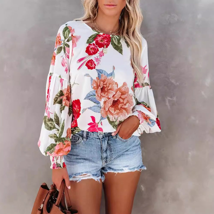 Damebluse med voluminøse ærmer og floral mønster Stilla