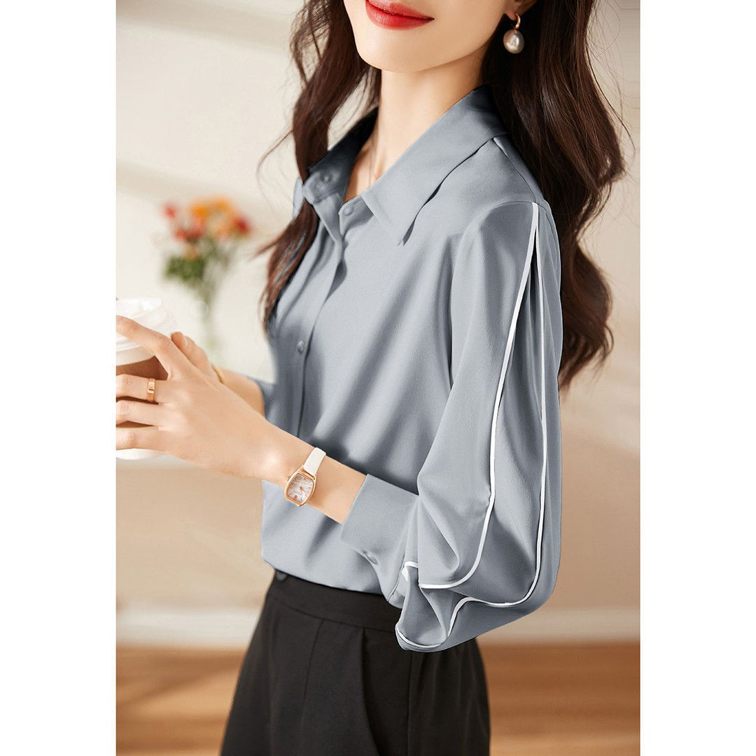 Damernes elegante bluse med klassiske knapdetaljer Stilla