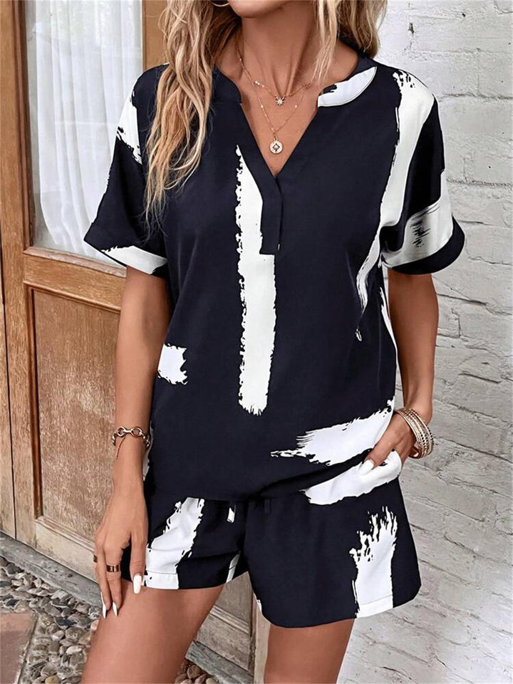 Dame moderat kort jumpsuit med abstrakt mønstret overdel og elastisk talje Stilla