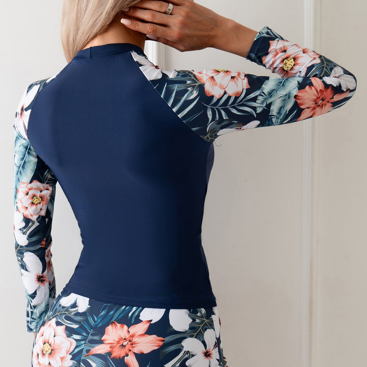 Dame Surfdragt med floral langærmet top og sports shorts Stilla