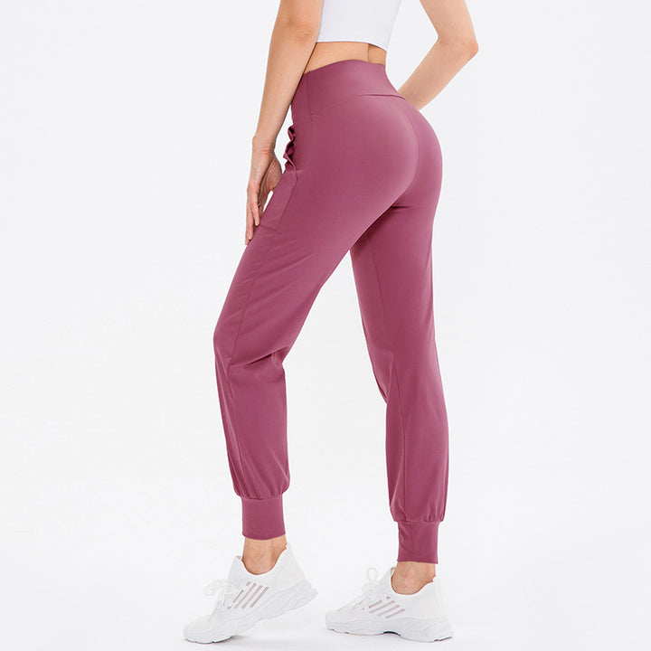 Dame elastisk sportsbukser med praktiske sidelommer og temperaturregulerende materiale Stilla