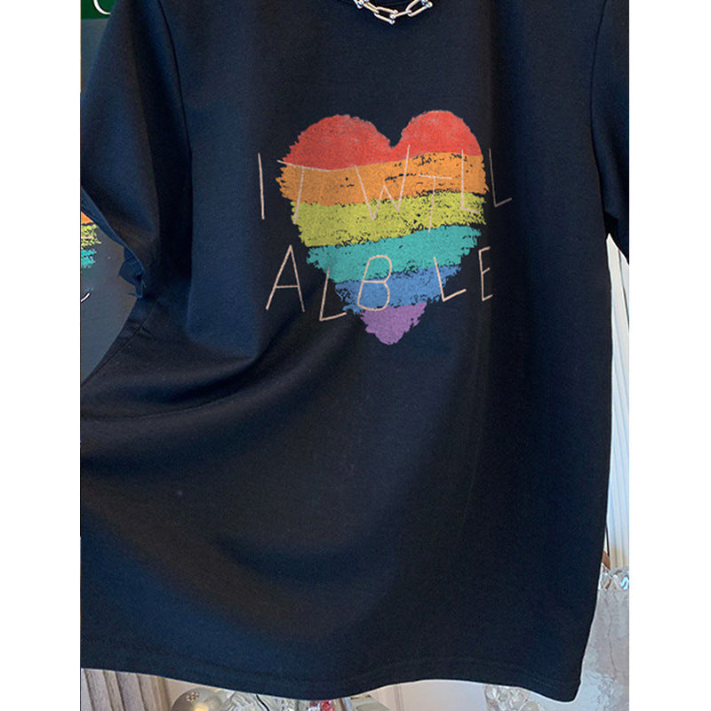 Dame T-shirt med kreativt regnbueskærtsmotiv og inspirerende skrift Stilla