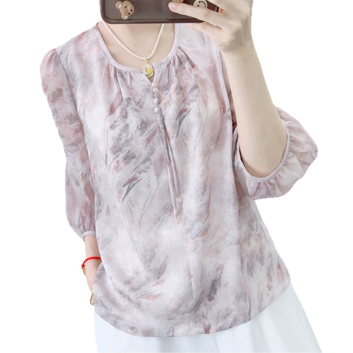 Damebluse med elegant blomsterdesign og feminine rynkede ærmer Stilla