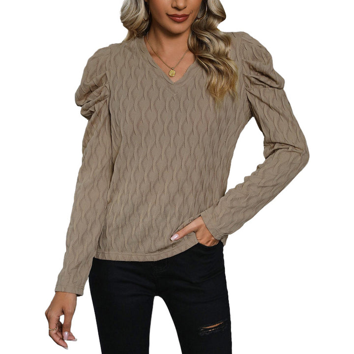 Kvinders sweater med tekstureret bølgemønster og elegante pufærmer Stilla