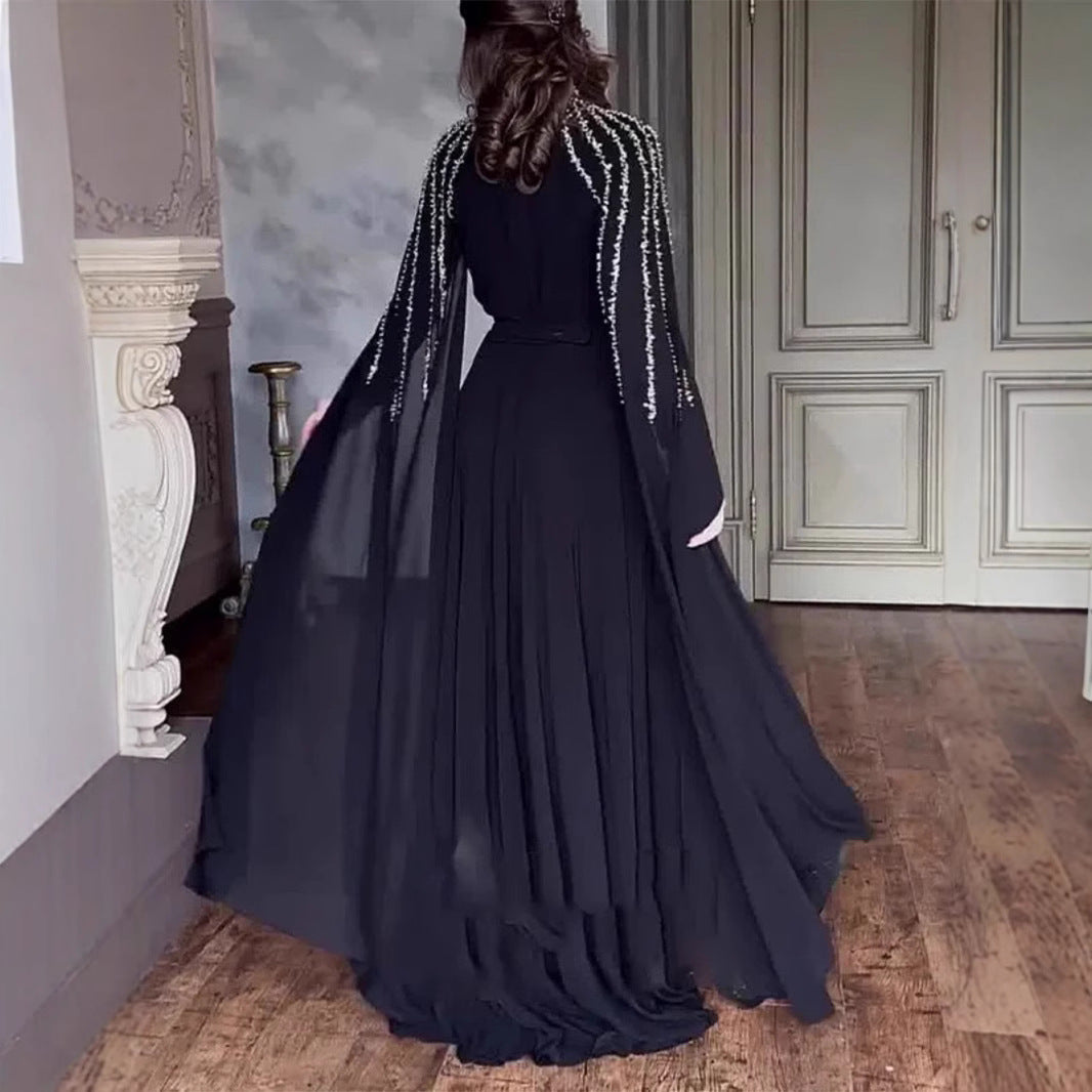 Dame Maxikjole med elegante, lange ærmer og detaljeret perleudsmykning Stilla