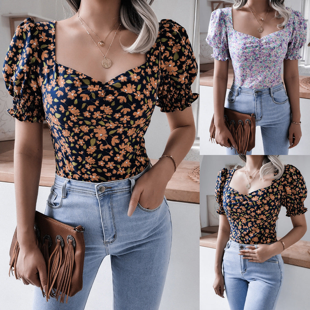 Damebluse i romantisk blomsterdesign med puffærmer Stilla