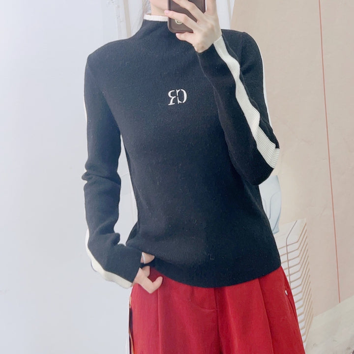 Dame elegant rullekrave sweater med kontrastærmer og moderne design Stilla