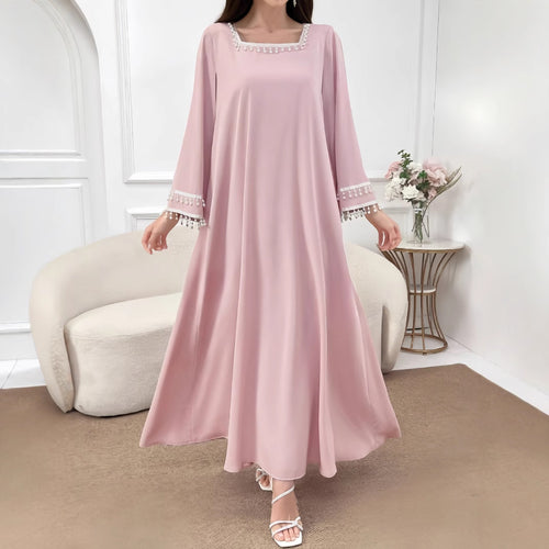 Kvindelige elegante maxi kjoler med dekorative franje og brede ærmer