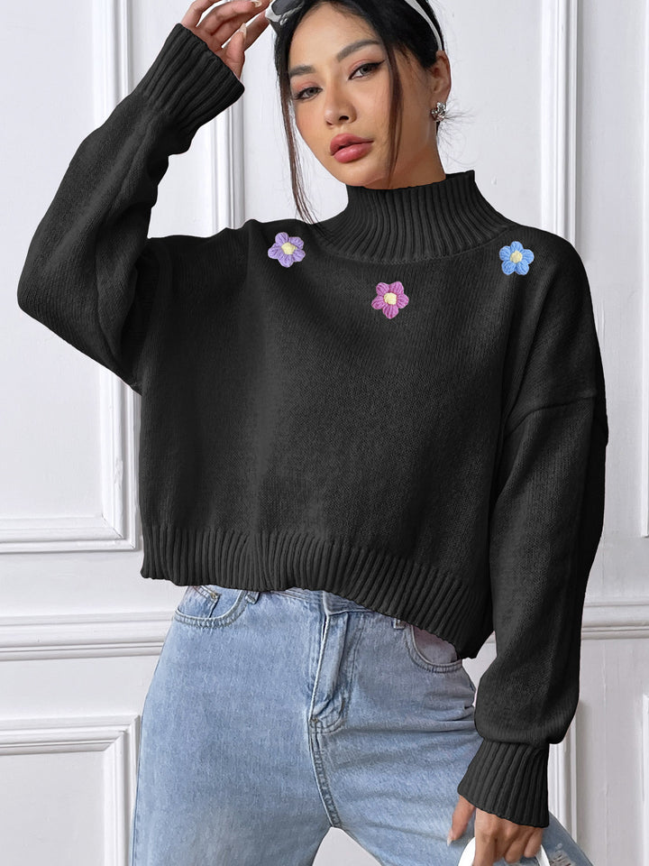 Dame elegant strikpullover med blomstret design og høj krave Stilla