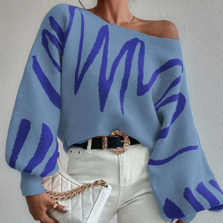 Kvinders oversized striktrøje med asymmetrisk design og afslappet halsudskæring Stilla