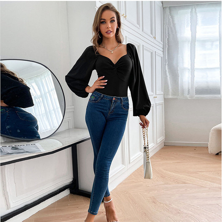 Kvindernes bodysuit med elegant V-hals og pufærmer Stilla