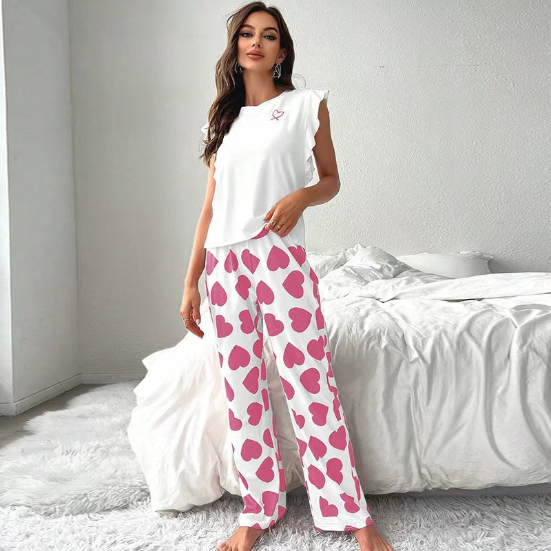 Dame pyjamasæt med legende hjerte-design og flæse detaljer Stilla