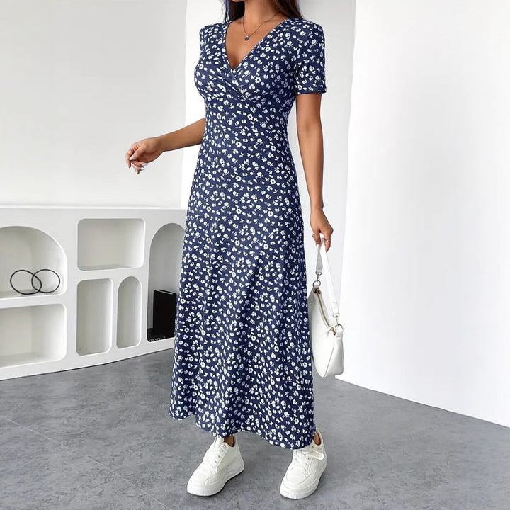 Dame Maxikjole med floral indpakningsdesign og praktiske sidelommer Stilla